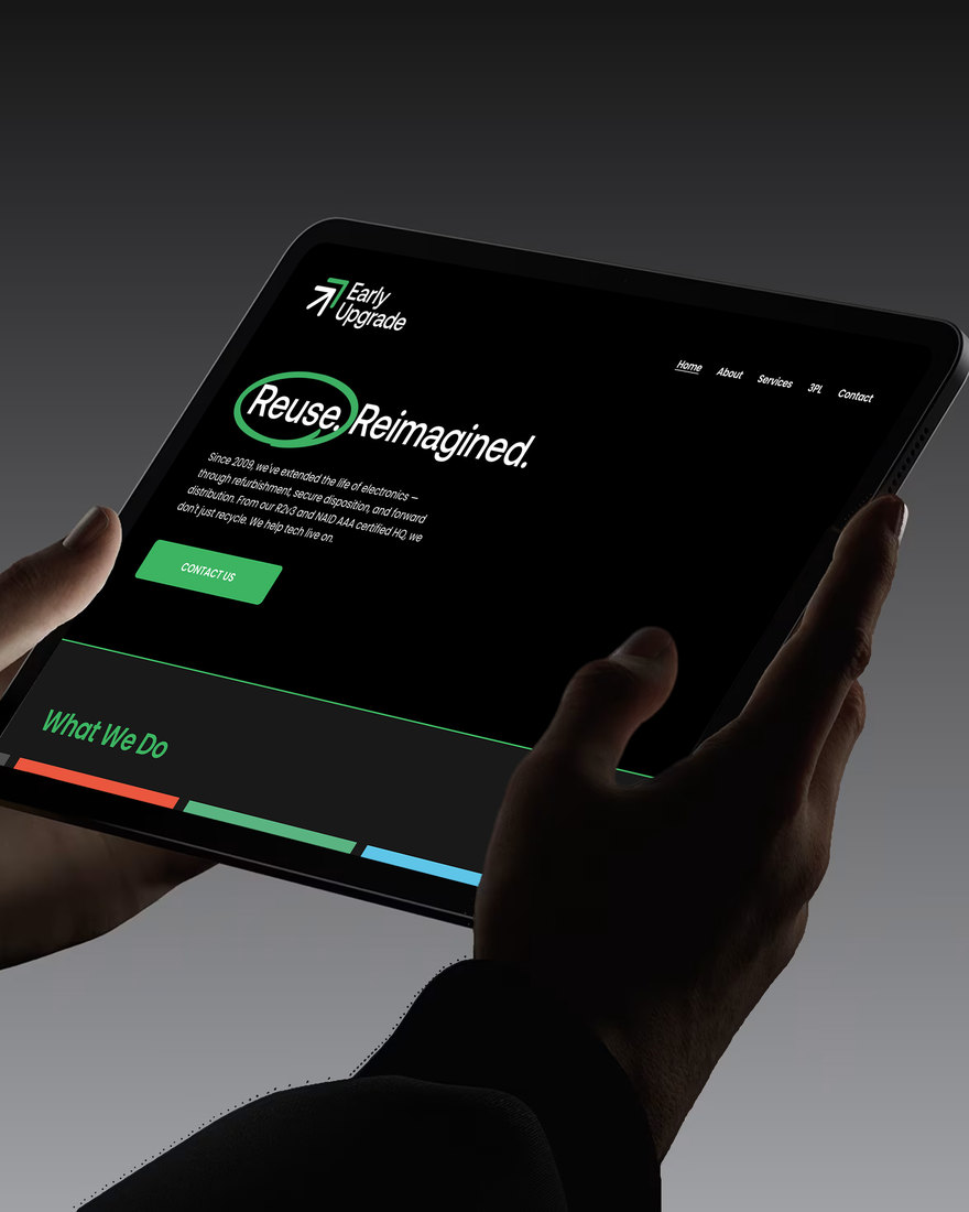 Hands holding a tablet showing the Early Upgrade website.