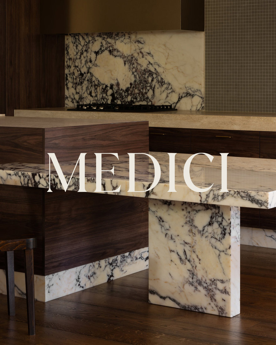 Medici Marble & Granite showroom with a marble and walnut island.